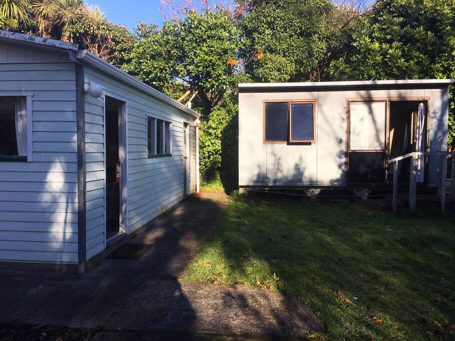 Living area on left and portacom (bedroom) on right