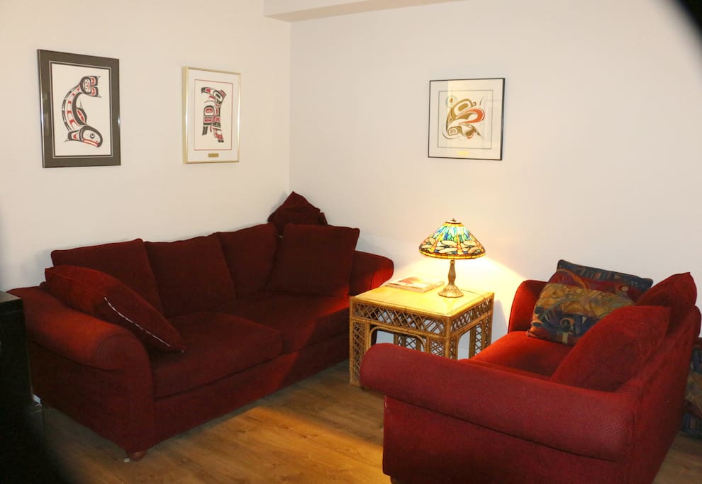 Open, high ceiling living room area; very comfortable couches