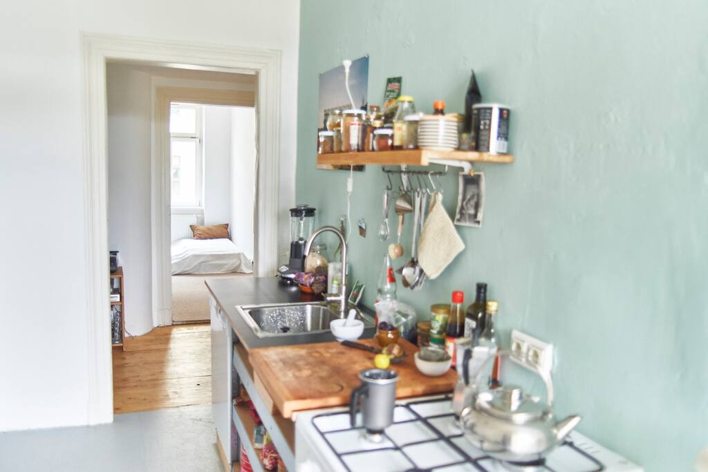 the kitchen with gas oven with your room in the background