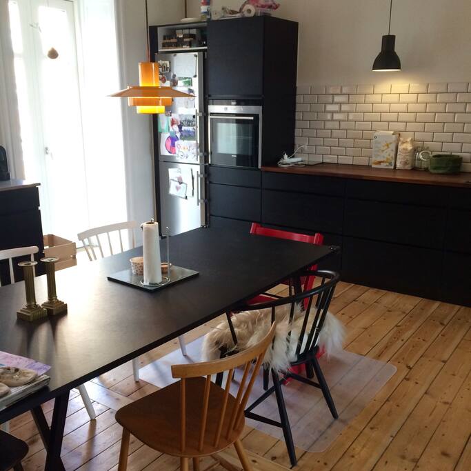 Open kitchen with big dining table