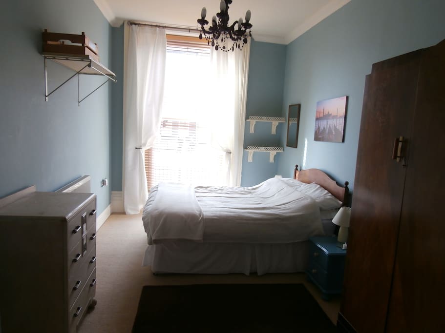 Large double bedroom with double wardrobe and drawers.