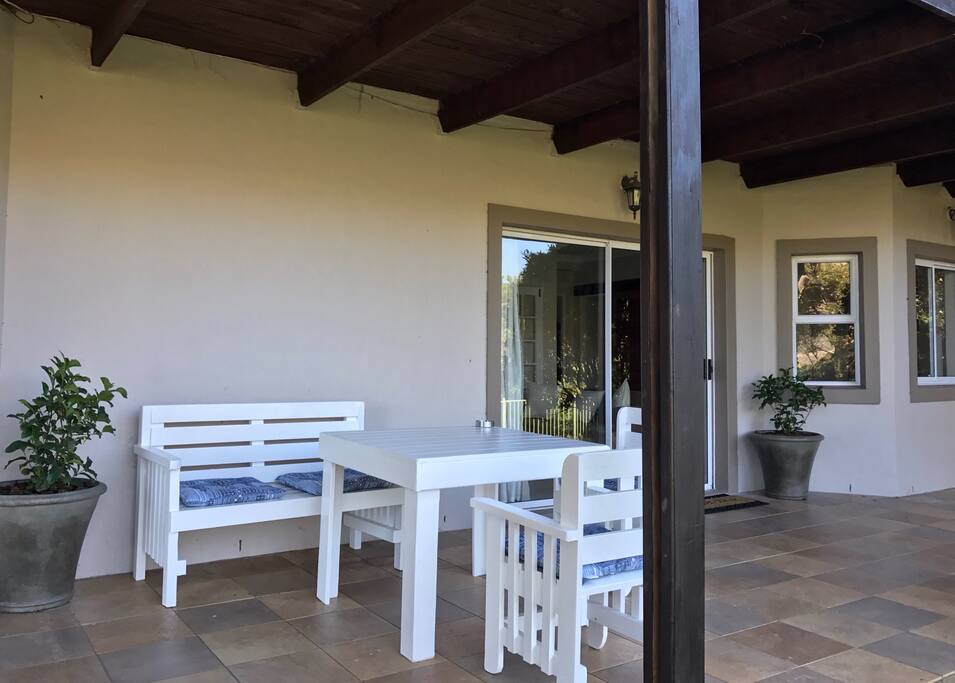 Comfortable seating on the patio in front of the apartment