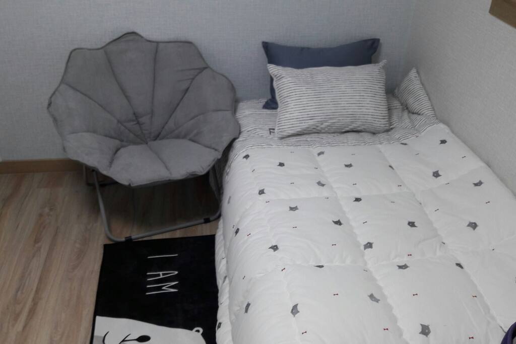A clean and comfortable bed is available.