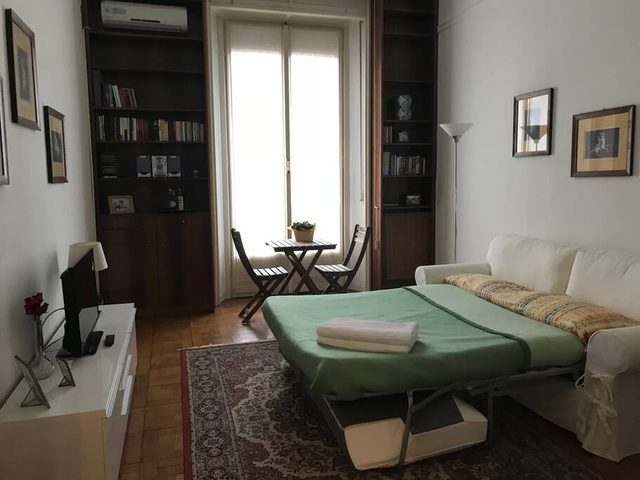 TV, air-conditioning, table and chairs are provided.
