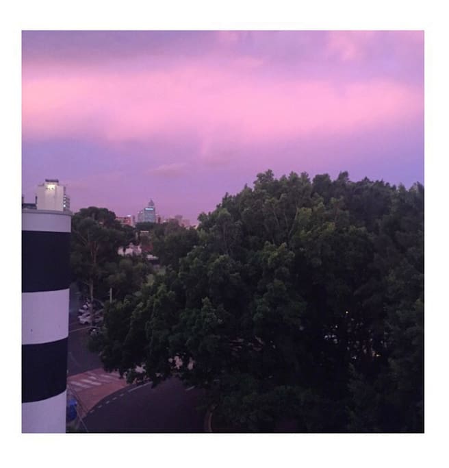 City view from room balcony (sunset)