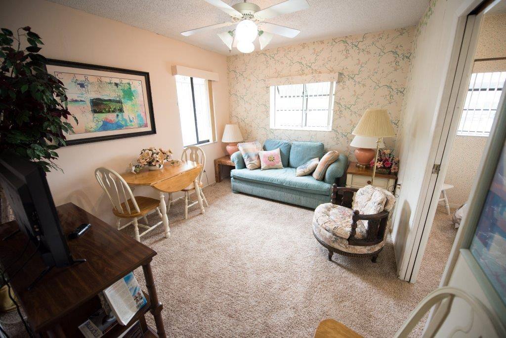 View of the living room showing the door to the bedroom