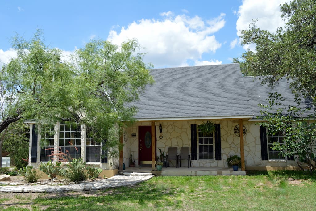 Relax on the front porch or in the large oak covered backyard...