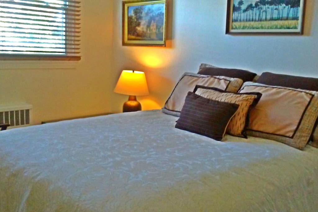 Luxuriate in your queen-sized bed outfitted with all-cotton sheets. Luggage rack and armchair also inhabit the room. Ceiling fan and independently controlled central air/heat provide for personalized comfort.