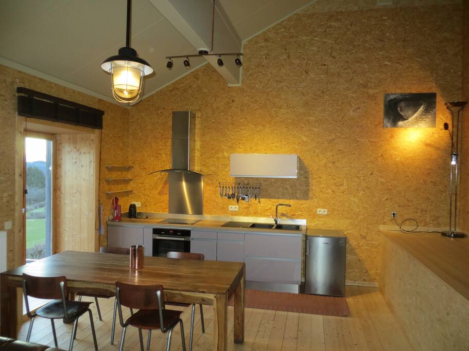 kitchen and dinner corner, with view on the valley of the Ourthe