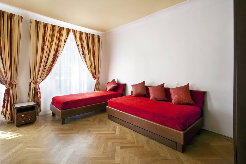 The living space has two custom made twin beds with real mattresses.