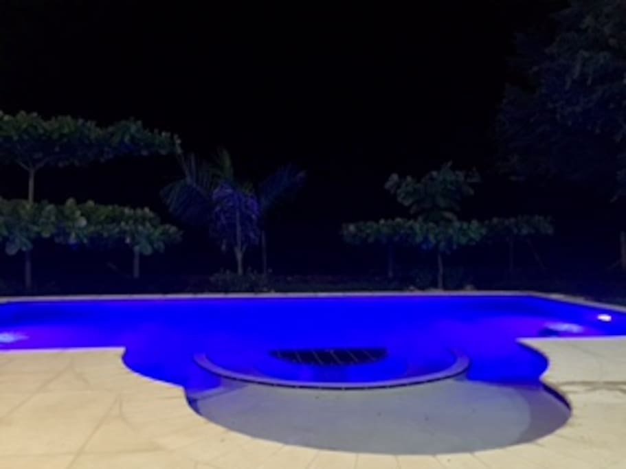 The pool lights create a great effect at night.