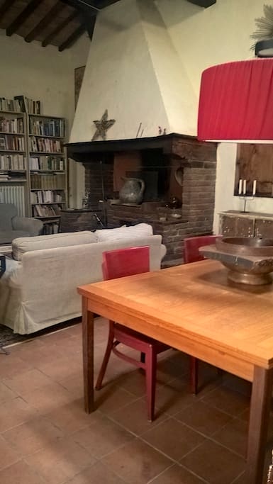 The old fire place becomes the center of the room in the winter months