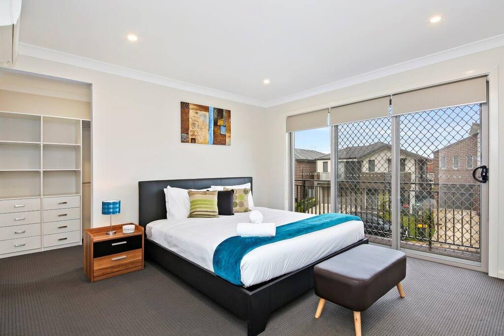 Master Bedroom with Queen Bed, an Ensuite and a private balcony