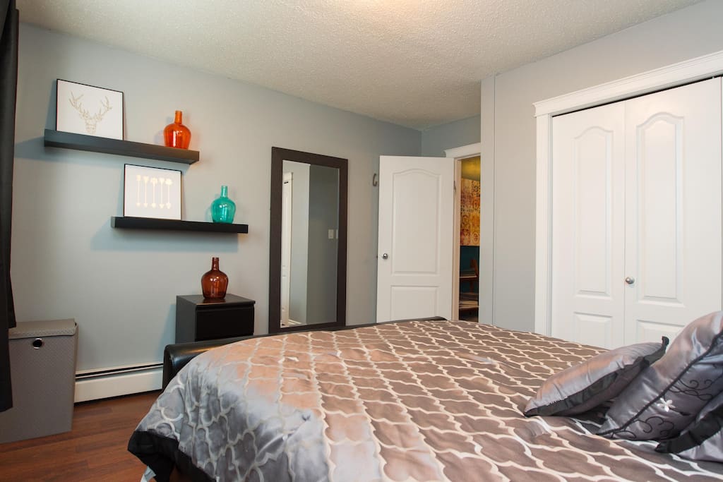 Master bedroom with full length mirror, laundry hamper and large closet (equipped with hangers)
