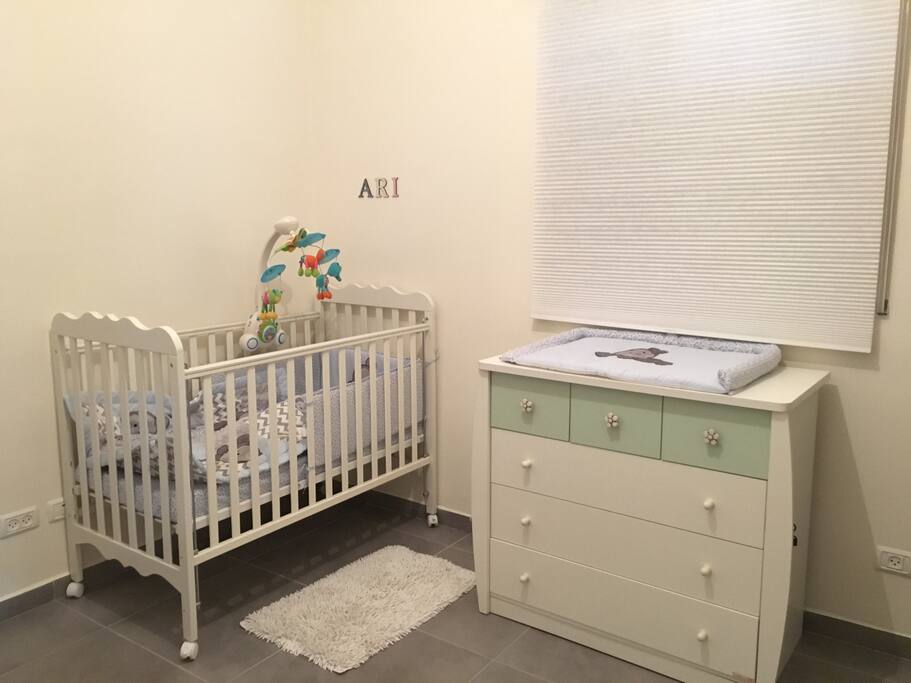 Second bedroom with 2 adult beds, and a bed for the child