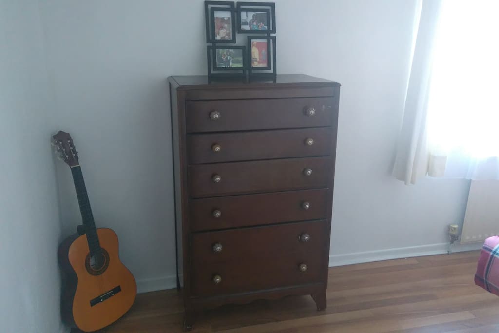 Chest of drawer and guitar