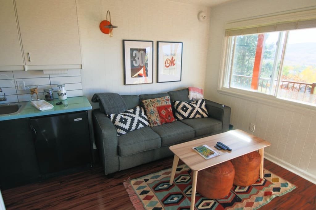 Queen Sofa Couch, Moroccan Poufs, Turkish Rug and Orange Light from Israel.