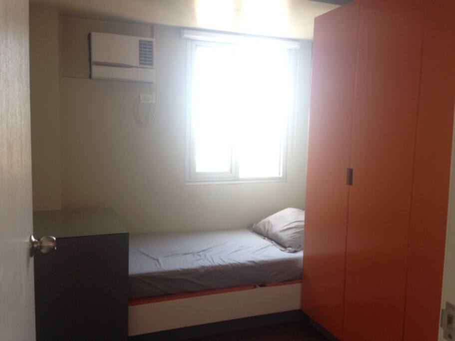 Bedroom 3 - single bedroom furnished with bed, clean sheets, airconditioning and cabinets