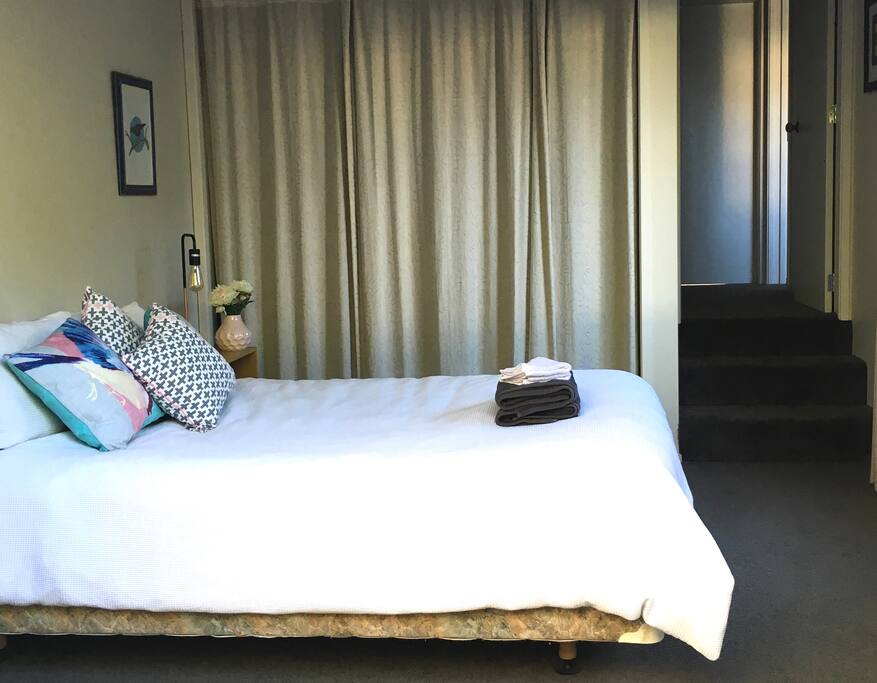 Private entrance into bedroom. Private bathroom up the stairs to the left.