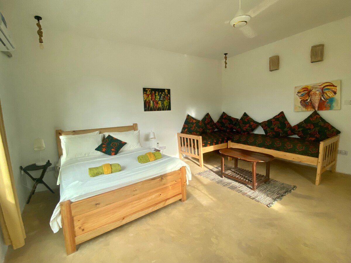 Two single beds set up as a cozy seating corner
