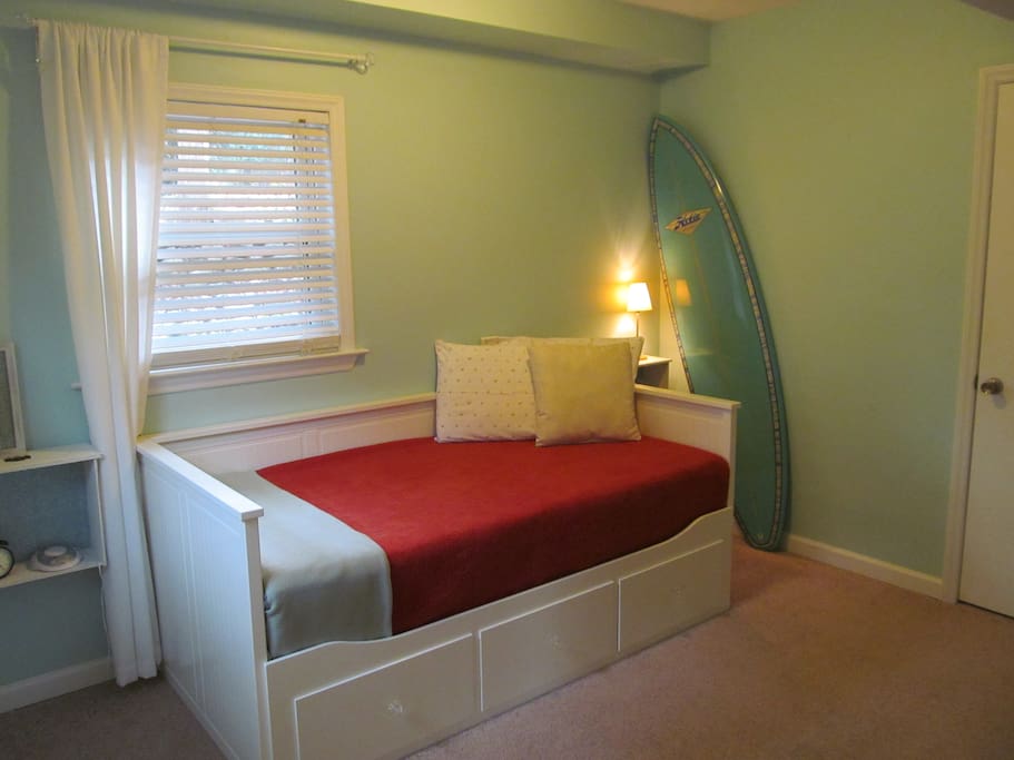 Bedroom with a view of the bed converted to a twin size bed if you're staying solo and want more floor space.