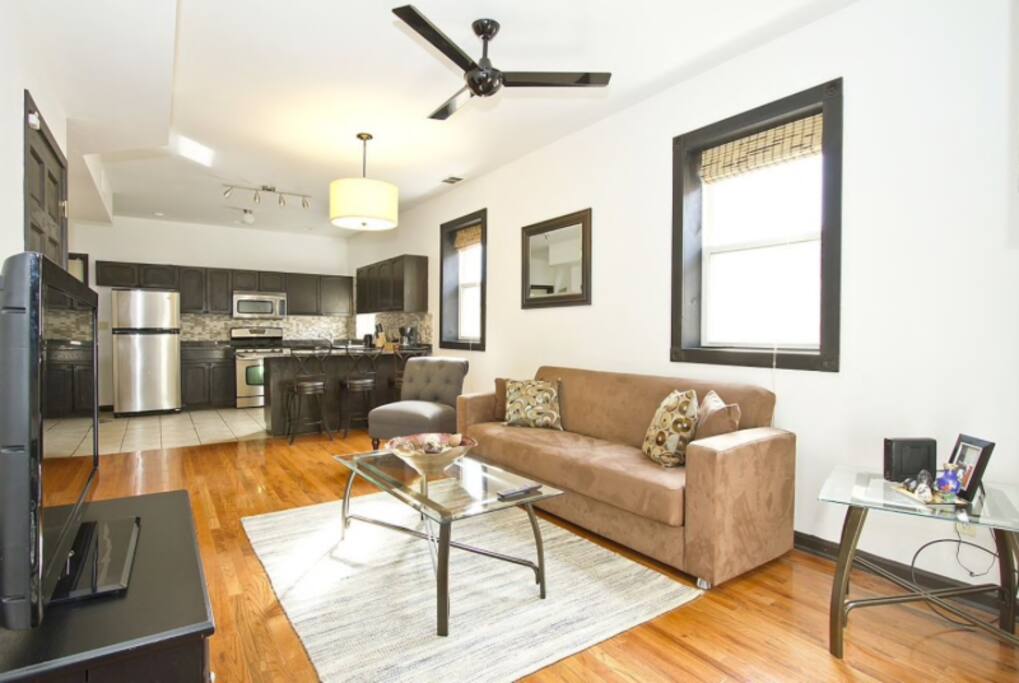 Living Room with TV that has Google Chromecast so you can stream your Netflix and any of your other favorite shows