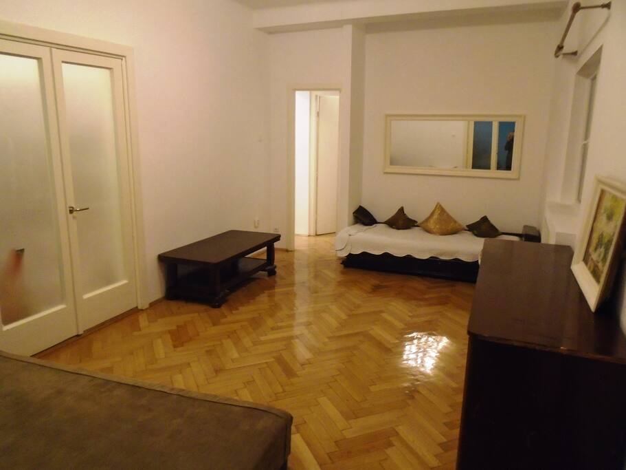 Living room with one double and one single beds