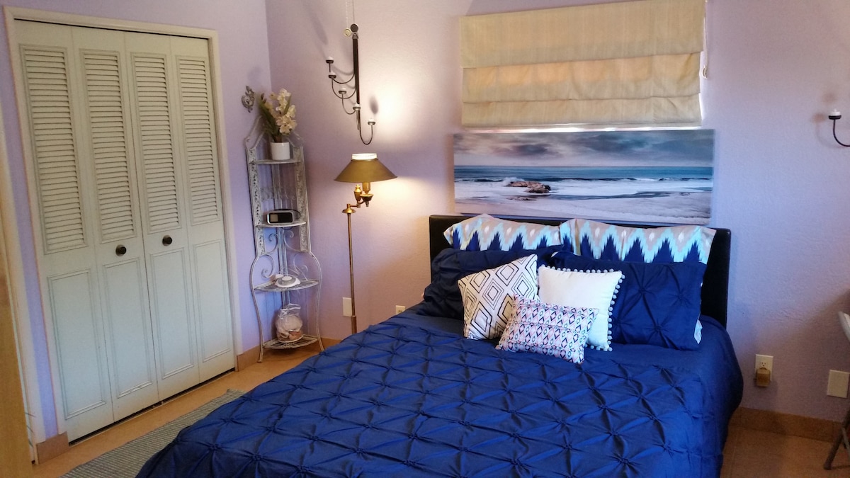 Two double closets (photo shows one closet) with built in side shelves and overhead shelves provide plenty of space for your belongings and luggage. 