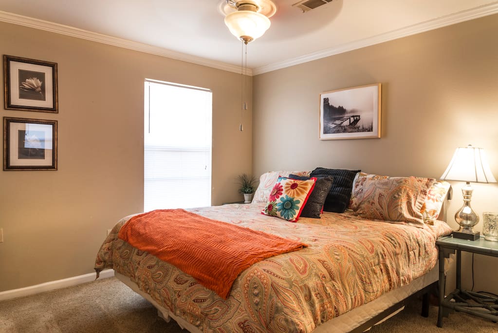 Queen bedroom with dresser and closet.