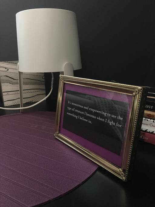 Night stand close up. Your room is surrounded by affirming quotes and art.
