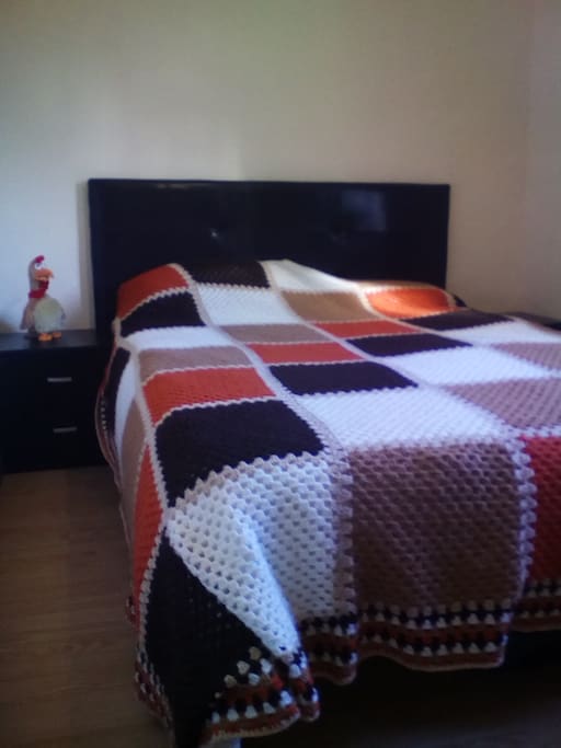 Large double bed, 2 bedside tables with drawers