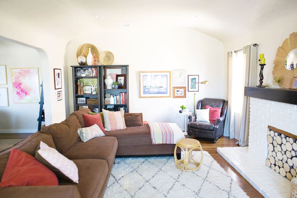 Cozy living room with a large sectional (that can be converted into two twin beds when you remove pillows if needed).