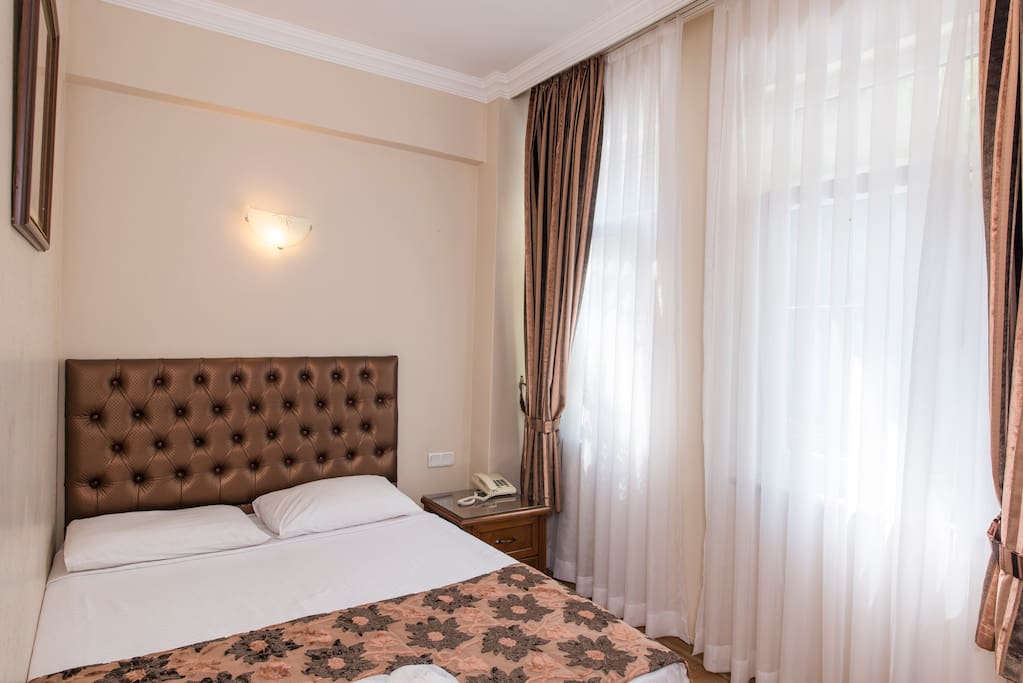 Clean, comfortable, modern room. Air-conditioned & Furnished with comfortable beds. Kettle & cups with complimentary tea bag, herbal tea, nescafe, cakes. A minibar supplied with complimentary water & mineral water. Plasma TV with international channels, bedroom slippers and standard toiletries, a hair dryer & free Wi-Fi connection. Daily cleaning. Laundry & Ironing service for a small extra cost.