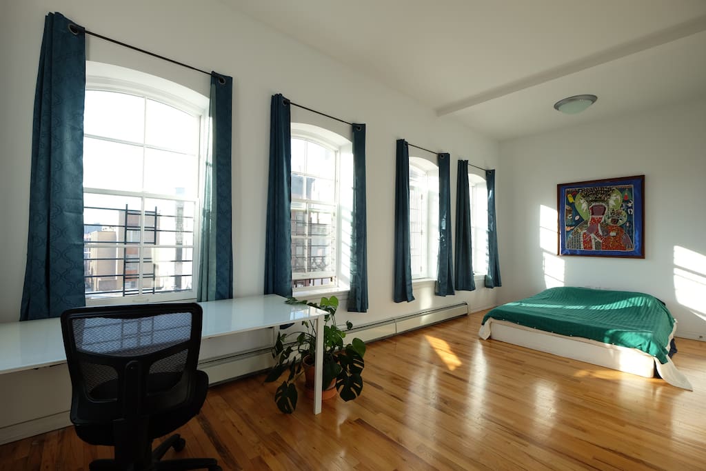 Enormous front bedroom with queen-size bed