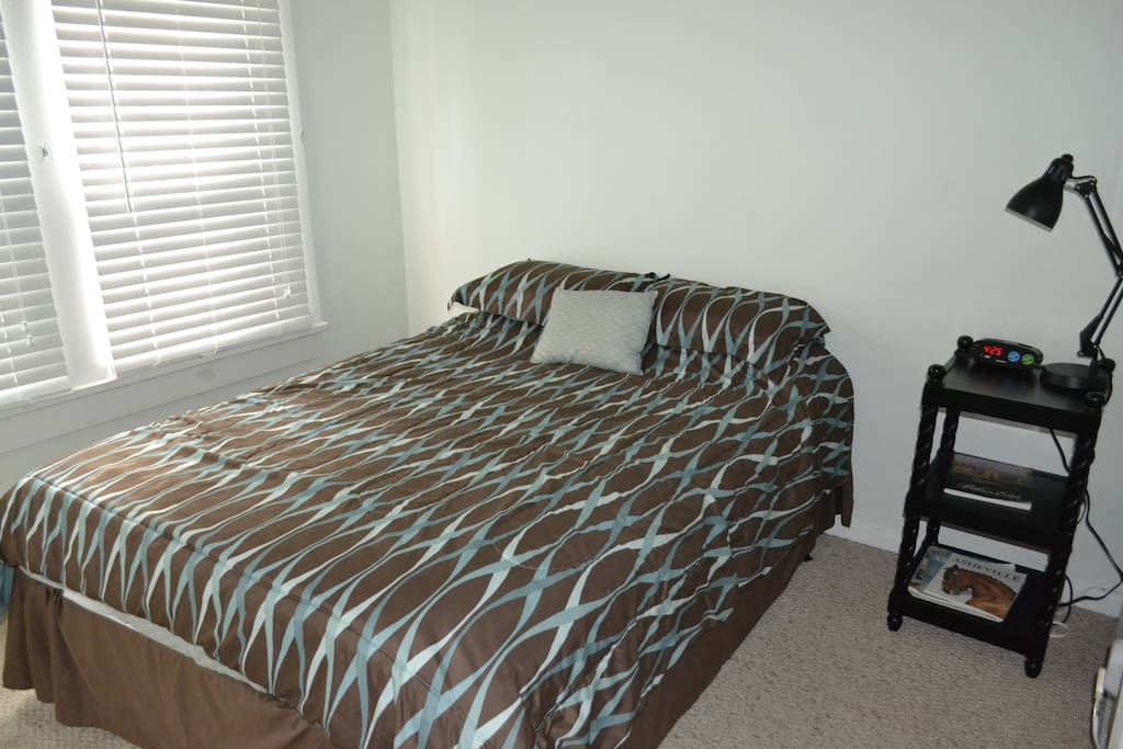 Updated bedroom area...now with an alarm clock :) Alarm clock also has ports to charge your devices.