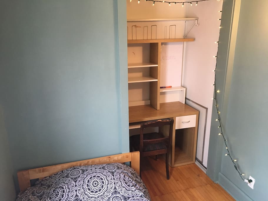 There's a desk and whiteboard in the room!