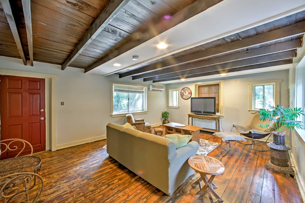 Hardwood floors and beautiful wood ceilings fill the interior of the main living space.