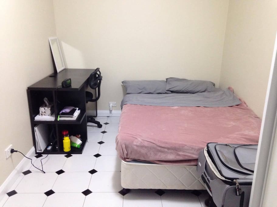 Bedroom with Bed + desk + chair. Sheets/covers will differ.