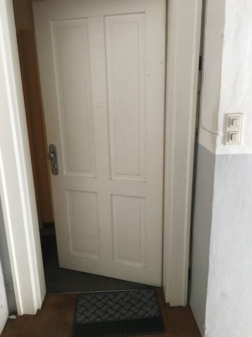Outside main door with code box to enter.