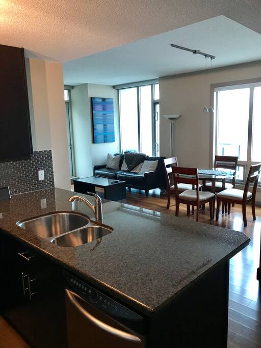 Full size kitchen opens up to living area.