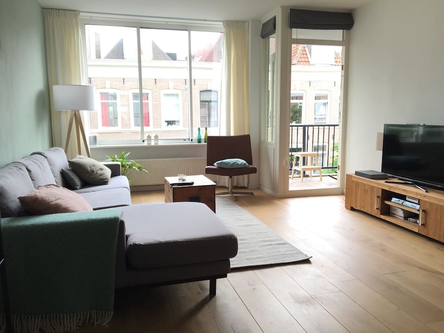 Living room with balcony, facing south (sun)