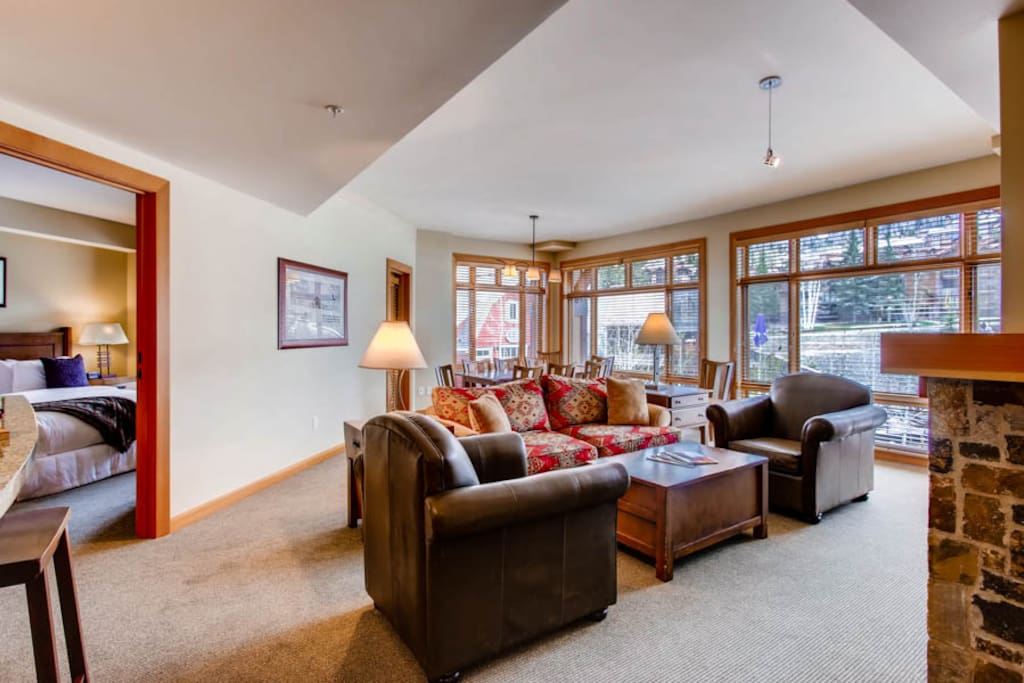 Open living area with views of Snowmass Mountain, ample sitting room, flat screen TV, and gas fireplace