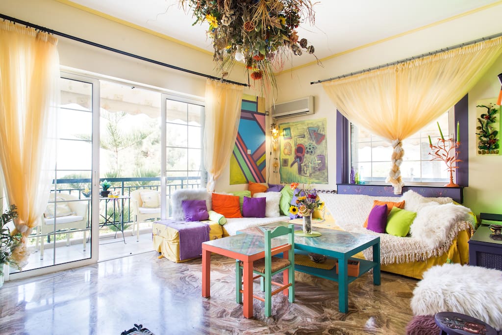 Living room with large window door leading to balcony