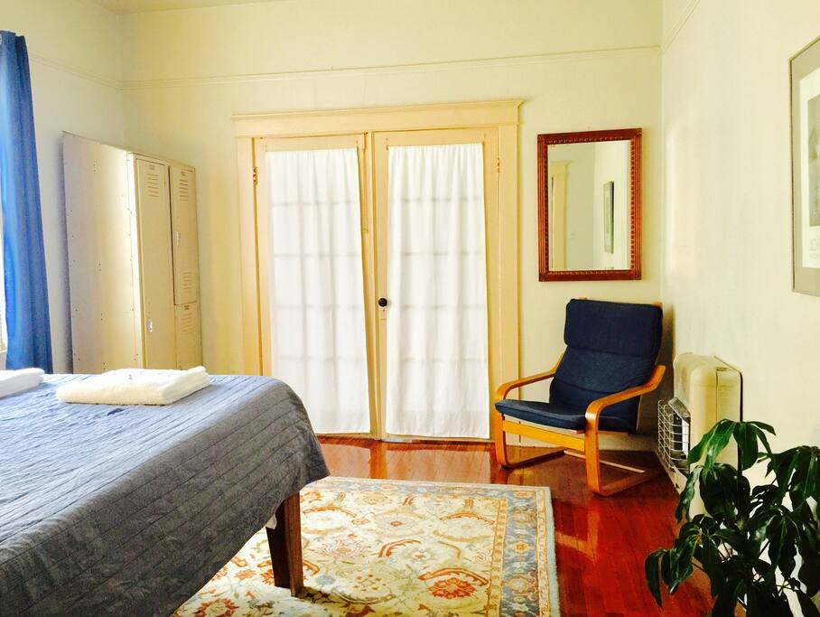 French doors separate the bedroom from the living room. Very useful if there are four guests!