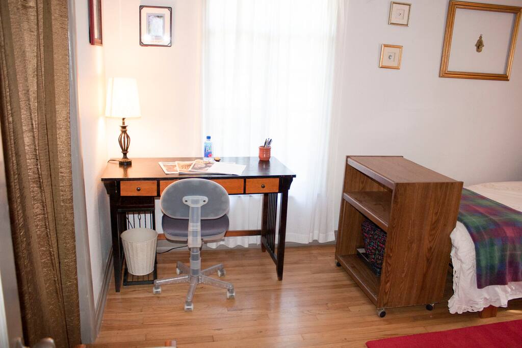 Desk, closet and a cabinet to lie your suitcase on
