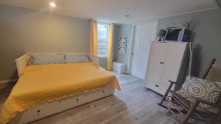 The bedroom features a queen size bed

Large egress window provides emergency exit and lots of extra light!