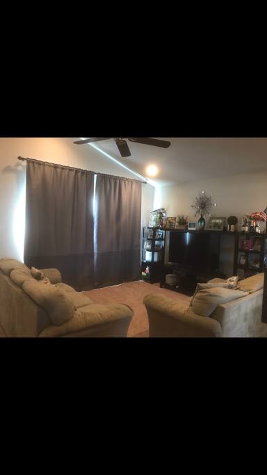 Catherdral ceiling living room, big screen HDTV, cozy couch and loveseat