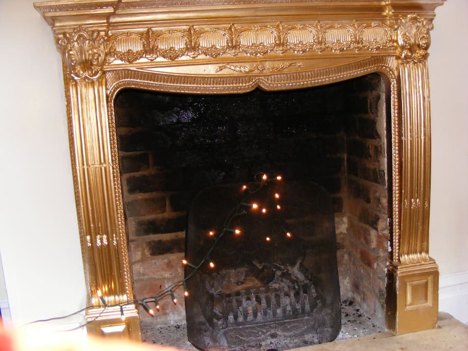 a large fireplace for candles or real log fires