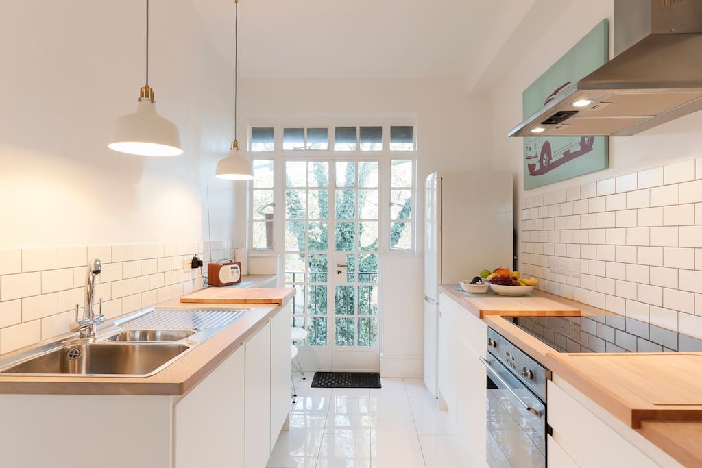 The kitchen comes fully furnished. There is also a small balcony at the end.