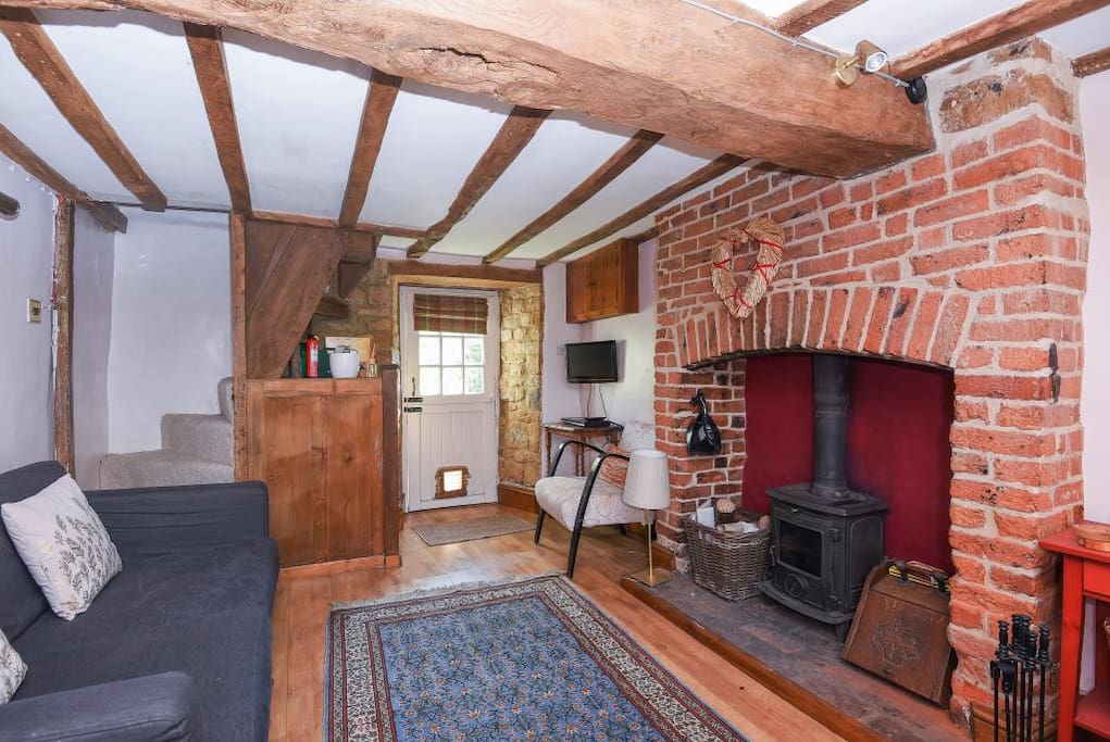 large traditional wood burner and feature fireplace